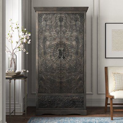 Talk about a statement piece! This two-door wardrobe is handcrafted from solid mango wood, and sports intricate, carved medallion designs on its doors and lower drawer for an eye-catching and romantic look. A neutral, distressed finish gives it vintage charm that helps it fight right in in a French country bedroom or guest room. Inside, four fixed drawers provide the perfect foundation for piles of sweaters and denim, or boxes and bins to help keep you organized. Hand-curated by Kelly Clarkson. French Country Bedroom, Solid Wood Armoire, Wood Armoire, Kelly Clarkson Home, French Country Bedrooms, Armoires & Wardrobes, Country Bedroom, Distressed Painting, Kelly Clarkson