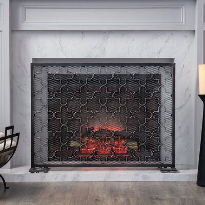 Enjoy a hot cup of cocoa next to your fireplace with the help of the charming fireplace screen. This fireplace screen offers a sleek accent to your interior space and also acts as a practical accessory. This screen can simply be placed in front of your fireplace to provide protection from hot embers or flying sparks with its fine mesh screen. Featuring precise, straight lines and a clover trellis pattern, this accessory highlights both functionality and style to give your home the best of the be Panel Fireplace, Indoor Fireplaces, Fake Plants Decor, Fireplace Screen, Fireplace Screens, Trellis Pattern, Indoor Fireplace, Christopher Knight, Mesh Screen