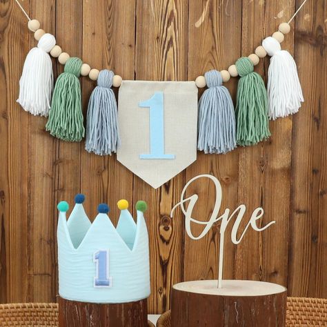 PRICES MAY VARY. 💓【PACKAGE CONTENTS】💓A tasseled garland banner containing the number "1" in white, green and blue with wooden beads. A blue crown hat with the number "1" and a "one" cake topper. This set is a great way to add a touch of color to your baby's birthday party. 💞【EASY TO ASSEMBLE】💞These products require no assembly and are easy to use. The banners are easy to hang and take no time to decorate. We will maximize your convenience. 💖【EXCELLENT QUALITY】💖The crown hat is well made an First Birthday Decorations Boy, Wedding Photo Booth Props, One Cake Topper, Birthday Highchair, 1st Birthday Party Decorations, Highchair Banner, Baby Boy First Birthday, One Cake, Blue Crown