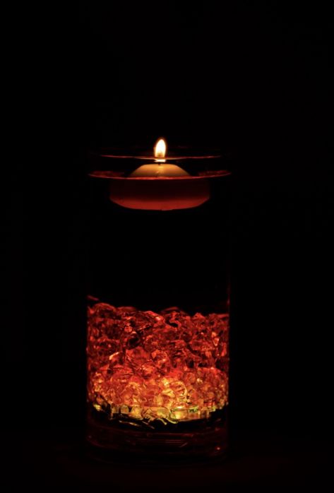 “Fire” centerpieces on red tablecloth. I put light in bottom of clear resin rocks. Light was set on “Yellow”. I added 3-5 drops of red food coloring dye, to give Fire look. Fire Themed Wedding, Fire Centerpieces, Fire Ice Party, Fire And Ice Party, Resin Rocks, Ice Ideas, Fire Wedding, Winter Gala, Ice Party