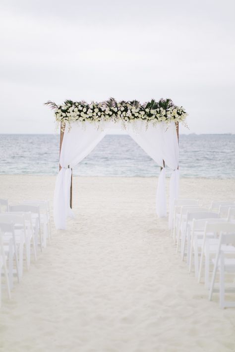 Wooden gazebo with white linen and top floral arrangment with greenery, roses, baby roses and phanelopsis orchid at Finest costa mujeres Floral Gazebo, White Gazebo, Wedding Gazebo, White Floral Arrangements, Wooden Gazebo, Gazebo Wedding, Top Floral, Tropical Wedding, All White