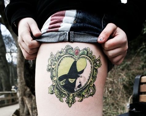 Wicked tattoo Wicked Musical Tattoo, Cameo Tattoo, Ninja Tattoo, Oz Tattoo, Elphaba And Glinda, Framed Tattoo, Literary Tattoos, Wicked Musical, Wicked Tattoos