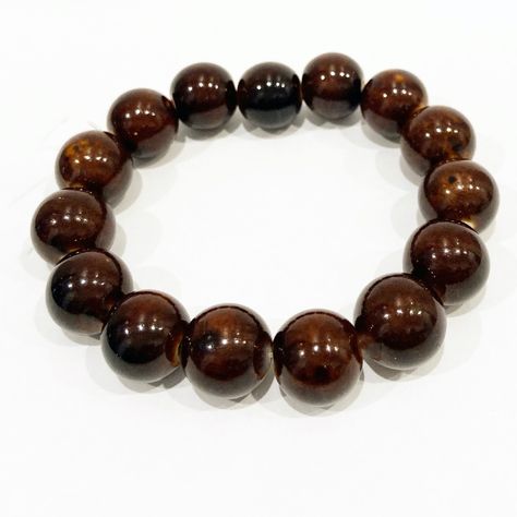 A Simple Brown Beaded Bracelet Featuring A Row Of Polished Brown Natural Stone Beads On A Durable Elastic Brown Leather Jewelry, Third Eye Pinecone, Leather Chain Bracelet, Wolf Pendant Necklace, Double Finger Ring, Stainless Steel Cross Pendant, Skull Pendant Necklace, Open Cuff Bracelet, Brown Jewelry