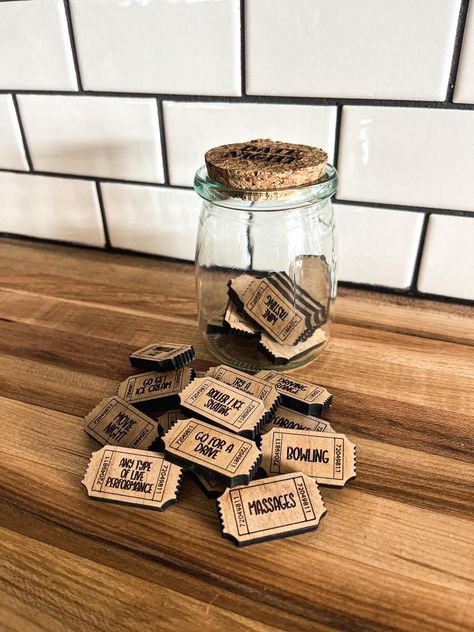 Never struggle to decide what to do for a date night again! Details: Jar is 3.5" tall and 2.5" wide with a cork top Includes 25 date night ideas including one "His Choice" and one "Her Choice" Examples of some of the activities Happy Hour Shoot Pool Watch the Sunset🌐#LoveStory #RomanticEncounters #HeartfeltConnections #DateNightIdeas #SoulmateSearch #FlirtyFridays #CandlelitDinners #StarryEyedMoments #LoveQuotes #DreamyDates #WhisperedPromises #AmourAdventures Jar Of Dates, Sports Medal Display, Date Jar, Date Night Jar, Kids Growth Chart, Christmas Stocking Ornament, Teacher Gift Card, Tiered Tray Diy, Diy Tray