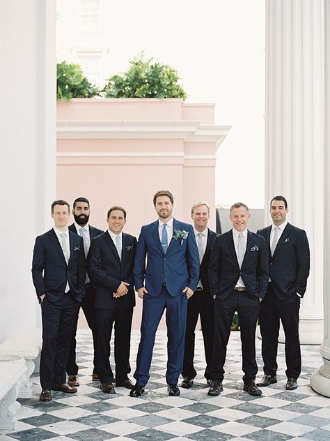 Groom In Blue Groomsmen In Black, Blue Groom Suit Black Groomsmen, Groom In Navy Groomsmen In Grey, Bestman Suit Groomsmen, Black And Blue Suits For Men, Dark Blue Groomsmen Suits, Navy Blue Suit Groom, Male Bridesmaid, Black Groomsmen Suits