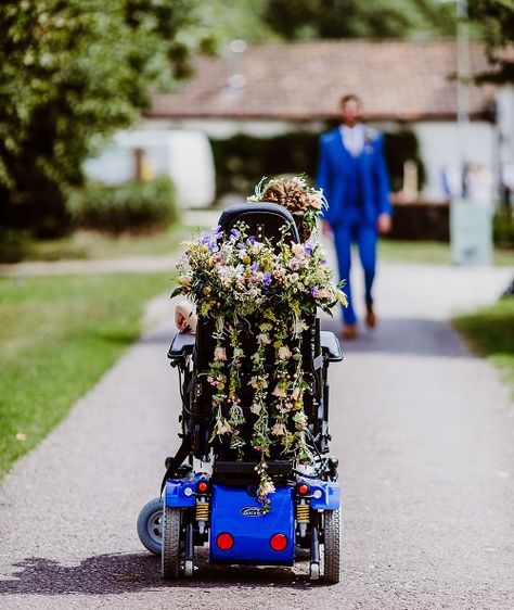 Tori's wheelchair from behind covered in flowers on her wedding day Wheelchair Decorations Ideas For Wedding, Wheelchair Wedding Ideas, Wheelchair Decorations Ideas, Wheelchair Decor, Wedding Wheelchair, Scooter Wedding, Wheelchair Decorations, Wheelchair Poses, Wheelchair Wedding