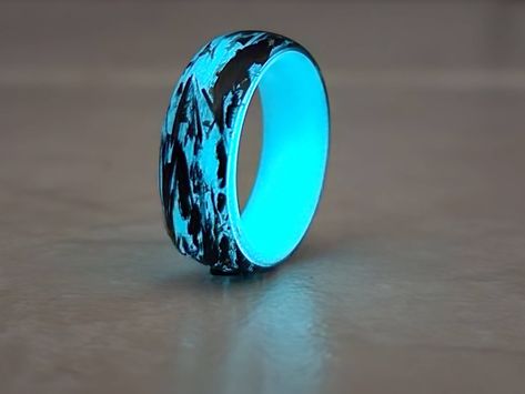 Gorgeous Forged carbon  ring, perfect for men and women. Good for wedding, for special occasion and for everyday use. The ring is handcrafted using carbon fiber, glow in the dark resin and Gold Foil Powder. The ring is Forged carbon outside and and aqua glow line inside. High quality and gentle design. Beautiful piece of art that will draw attention and get compliments everywhere you wear it. Please note, You can choose the size of the ring, see variations. The ring will always arrive in a nice gift box ready to open or give away. Custom orders are always welcomed. If You love it, please like, pin or twit. Thanks for stopping by  :) Glow In The Dark Ring, Glow In The Dark Resin, Black Band Ring, Dark Ring, Glow Ring, Forged Carbon Fiber, Dark Rings, Silicone Wedding Band, Carbon Fiber Rings