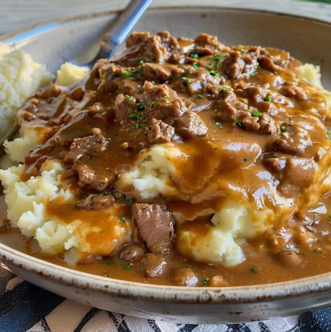 Make Beef and Gravy with Mashed Potatoes Stew Meat Over Mashed Potatoes, Beef And Gravy With Mashed Potatoes, Mashed Potatoes With Meat, Mashed Potato Bowls With Ground Beef, Meat And Mashed Potatoes Recipes, Ground Beef And Gravy Over Mash Potatoes, Ground Beef Over Mashed Potatoes, Hamburger Gravy Over Mashed Potatoes, Cheeseburger Meatloaf Recipes