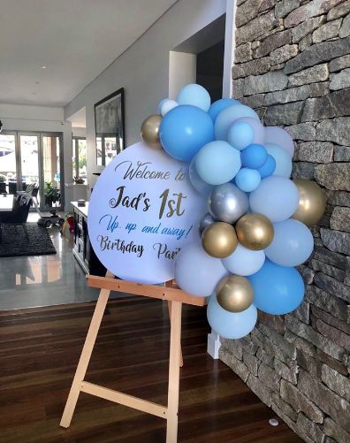 Balloons On Welcome Sign, Welcome Easel With Balloons, Balloons Around Welcome Sign, Welcome Sign With Balloons And Flowers, Balloon Easel, Sky Blue Balloons Decorations, Chocolate Babies, Birthday Event, Event Signage