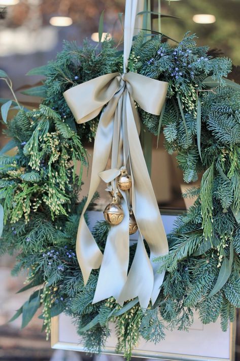 12" Heavy Duty Wire Form with Brackets Snips Floral Wire Steps : Traditional (on store front door) : Create 10 small bundles of greens. I used Noble Fir, Willow Eucalyptus, Incense Cedar & Juniper. I put one sprig of each in the bundle then wrapped the stems together with floral wire. Layer the bundles around the form, overlapping at the stems all the way around. On the last one, you will have to tuck the stems under the first bundle. Bend in wire form to hold bundles to the frame. Wrap the enti Woodsy Christmas Wreath, Wreath With Bells And Ribbon, Christmas Decor With Eucalyptus, Christmas Wreaths In Windows Outside, Wreath For Front Door Christmas, Bells On Wreath, Christmas Wreath Vintage, Vintage Wreaths Christmas, Simple Xmas Decor