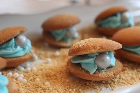 Under the Sea Dessert Table · Edible Crafts | CraftGossip.com Oyster Cookies, Pearl Baby Shower, Sea Baby Shower, Edible Crafts, Beach Wedding Cake, Mermaid Baby Showers, Baby Mermaid, Vanilla Wafers, Beach Wedding Favors