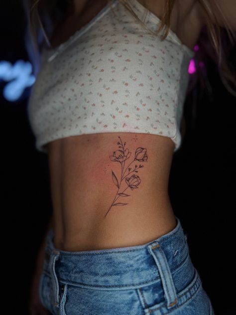 Good Places To Get Flower Tattoos, Floral Rib Cage Tattoos For Women, February Flower Butterfly Tattoo, Where To Put A Flower Tattoo, Side Body Flower Tattoo, Waist Flower Tattoo For Women, Tattoo Placement Ideas Flowers, Flower Tattoos Delicate, Flowers On Side Tattoo