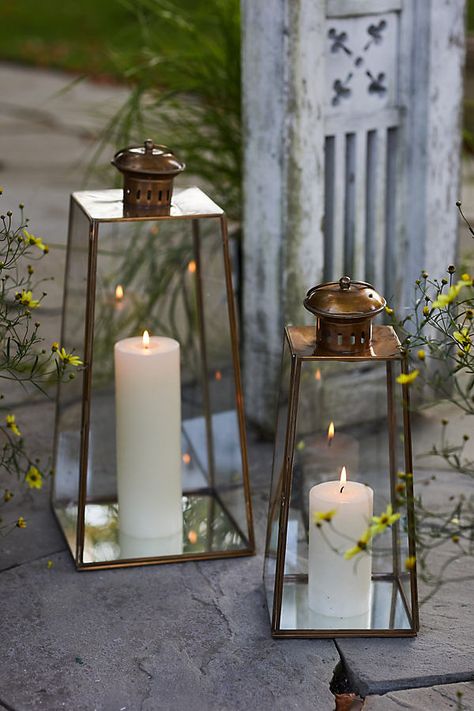 Defined by its pyramid silhouette and brass finish, this classic lantern is the perfect place to display candles or strands of lights. Animation Environment, Lantern Pathway, Glowing Forest, Solar Lantern Lights, Lantern String Lights, Iron Lanterns, Candle Displays, Brass Lantern, Solar Lanterns