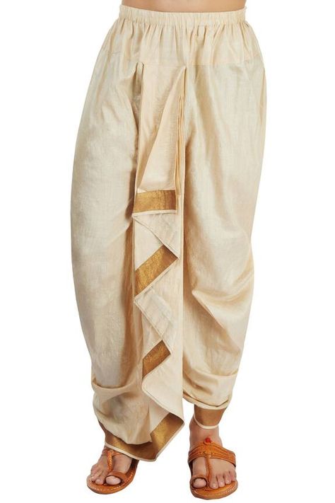 Beige draped dhoti with an elastic waistband, a centre front patli that is continued to the back and a gold border at the hem. Components: 1 Fabric: Monga silk Color: Gold Other details: Centre front patli Gold border Elastic waistband Note: The kurta worn by the model is not for sale. - Aza Fashions Paithani Dhoti For Men, Dhoti Pants For Men, Tassels Designs, Saree Tassels Designs, Eyes Aesthetic, Wedding Dresses Men Indian, Model Blouse, Saree Tassels, Fall Fashion Coats