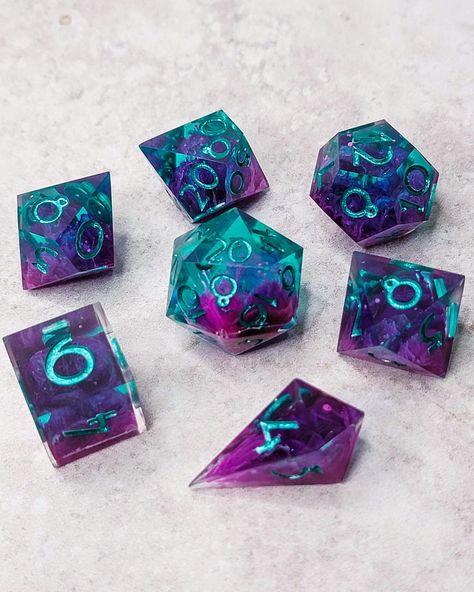 This is a Handmade set (including pouring, sanding, polishing, and painting) it does contain small surface flaws. The dice have been cured in a pressure pot, so there should be no internal bubbles. This set is inked in Teal This set includes 1-D4, 1-D6, 1-D8, 1-D10, 1-D%, 1-D12, and 1-D20. Dice Ideas, Cool Dnd Dice, Pressure Pot, Dragon Dies, Dungeons And Dragons Dice, Role Playing Games, Modern Tattoos, Dnd Dice, Playing Games