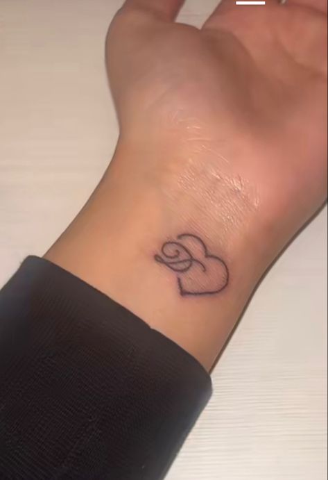 Small Loved One Tattoo, Tattoo On Wrist Black Women, Cursive D Tattoo With Heart, Initial Tattoo Black Women, Cute Simple Wrist Tattoos, Butterfly Tattoo With Initials Inside, Small Boyfriend Name Tattoos For Women, Last Name Tattoos For Men On Back, Under Buttcheek Tattoo Black Women