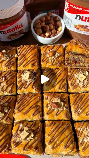 SCARLETT HOLMES🌟easy recipes! on Instagram: "NUTELLA BAKLAVA❤️🥰🫶
Probably my new favourite dessert!!! Crispy buttery filo pastry sheets, roasted halzelnuts & delicious Nutella. 

#recipe (16 servings)
Syrup
❤️ 140 mL water
❤️ 115g caster sugar
❤️ 135g honey
❤️ 1 Tbsp lemon juice
Baklava
❤️ 40 sheets filo pastry (cut to size)
❤️ 280g salted butter, melted
❤️ 420g nutella
❤️ 250g hazelnuts, finely chopped

1.Make the syrup first to ensure it’s cool when making the baklava. If you pour hot syrup over a hot baklava it will go soggy. Add all ingredients to a saucepan and bring to the boil. Then reduce heat to low and simmer for 6 minutes. Remove from heat and let it cool, refrigerate.
2.Butter the bottom of an 8x8 baking dish. Place a piece of filo pastry down (you may need to cut it to size Nutella Baklava Recipe, Nutella Baklava, Filo Pastry Recipes, Nutella Recipe, Bbq Party Food, Baklava Recipe, Armenian Recipes, Filo Pastry, Cookie Cake Recipe