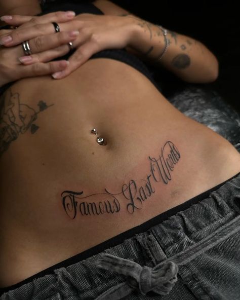 160 Exploring the Beauty of Women’s Stomach Tattoos: Designs and Inspiration - Psycho Tats Women’s Face Tattoo Ideas, Stomach Name Tattoo, Beautiful Words Tattoo, Side Of Torso Tattoos, Below Belly Button Tattoo, Lower Back Name Tattoos, Swirly Tattoos For Women, Sick Back Tattoos, Women’s Stomach Tattoo