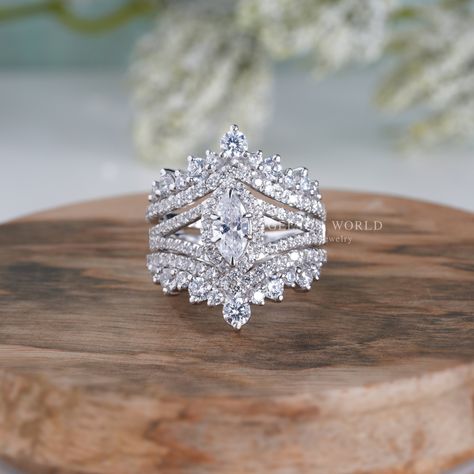 💍 𝐈𝐭𝐞𝐦 𝐃𝐞𝐬𝐜𝐫𝐢𝐩𝐭𝐢𝐨𝐧 💍 Art Deco Bridal Engagement Ring With Enhancer, Enhancer Wedding Ring Sets For Women, Moissanite Ring Guard Set Marquise Halo Ring Jacket Set, Unique Design and Style By Gelson World.  💍 𝐌𝐄𝐓𝐀𝐋 💍 ✶Solid 10K/14K Yellow/White/Rose Gold ✶ Solid 925 Sterling Silver ✶ Rhodium Plated 💍 𝐌𝐀𝐈𝐍 𝐒𝐓𝐎𝐍𝐄 💍 ✶ Stone Shape : Marquise Cut ✶ Stone Type : Moissanite  ✶ Stone Size : 8x4 MM ✶ Carat Weight : 0.50 Ct ✶ Moissanite Color : Near Colorless ✶ Moissanite Clarity : VVS1   💍 𝐒𝐈𝐃𝐄 𝐒𝐓𝐎𝐍𝐄𝐒 💍 ✶ Stone Shape : Round Cut  ✶ Stone Type : Moissanite ✶ Moissanite Color : Near Colorless ✶ Moissanite Clarity : VVS1 💍 𝐓𝐎𝐓𝐀𝐋 𝐂𝐀𝐑𝐀𝐓 𝐖𝐄𝐈𝐆𝐇𝐓 💍 ✶ Total Carat Weight : 2.35 Tcw 💍 𝐏𝐑𝐎𝐃𝐔𝐂𝐓 𝐈𝐍𝐂𝐋𝐔𝐃𝐄𝐒 💍 ✶ Engagement Ring ✶ Jewelry Ring Guards Enhancer For Marquise, Wedding Band For Marquise Ring, Engagement Ring With Enhancer, Ring With Enhancer, Wedding Ring Sets For Women, Ring Sets For Women, Wedding Ring Guard, Ring Jacket, Vintage Inspired Engagement Rings