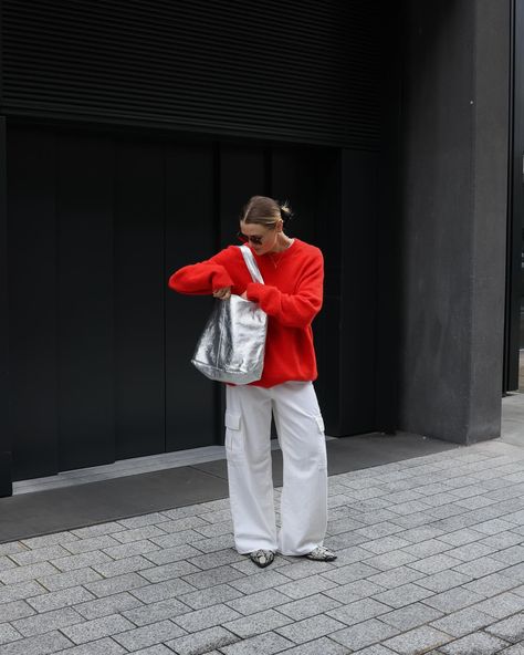 Slightly obsessed with this bag 🥹 Silver bag, red jumper, white jeans, spring outfit, white jeans outfit, white jeans style, spring fashion, minimal fashion style, daily outfits