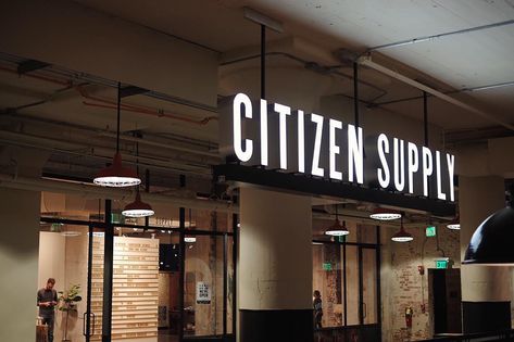 Environmental retail sign and branding for Citizen Supply neon and iron hanging sign in front of store inside Ponce City Market in Atlanta. Signage Restaurant, Lightbox Signage, Restaurant Signage, Illuminated Signage, Store Branding, Signage Board, Company Signage, Retail Signage, Shop Signage