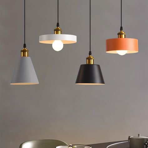 [FEATURE] 
 The Colorful Resin Geometric Pendant Lamp boasts a sleek, modern design that combines resin and metal, featuring geometric shapes in a variety of vibrant hues. Its warm and inviting glow adds a touch of refinement to any setting, making it an ideal choice for those in search of a striking and contemporary lighting fixture.