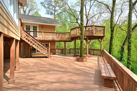 Large two level deck with outlook of surrounding trees Deck Ideas On A Slope, Diy Gravel Patio, Gravel Patio Ideas, Steep Backyard, Gravel Pavers, Backyard Deck Ideas, Slope Landscape, Landscaping Around Deck, Two Level Deck