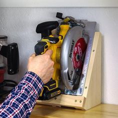 Learn how to make a DIY circular saw storage holder with these step-by-step plans. This space-saving DIY holder is the perfect way to store a circular saw in your workshop. This is a simple afternoon project that can be made with a few simple cuts, a few common tools, and a few pieces of scrap wood. Get the easy-to-follow plan now! Circular Saw Storage, Saw Storage, Cleat Storage, Working Tables, Door Remodel, Shop Hacks, Woodshop Ideas, Garage Organizing, Lazy Man