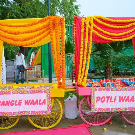 Indian Wedding Giveaways, Carnival Wedding Theme, Haldi Decoration Ideas, Stall Decorations, Sangeet Decor, Mehendi Decor Ideas, Indian Wedding Decor, Carnival Decorations, Wedding Entrance Decor