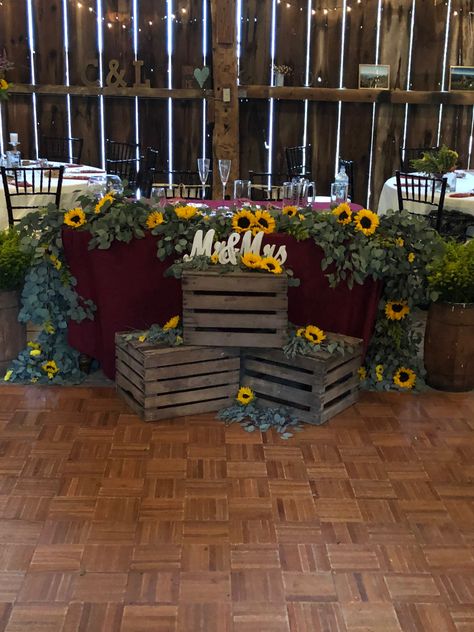 Burlap And Sunflower Table Decorations, Rustic Wedding Centerpieces Sunflowers, Sunflower Diy Wedding Decor, Sunflower And Wine Color Wedding, Sunflower Bride And Groom Table, Rustic Sunflower Decor, Head Table Sunflower Wedding, Fall Sunflower Table Decor, Navy Blue And Sunflower Wedding Wedding Table Decor