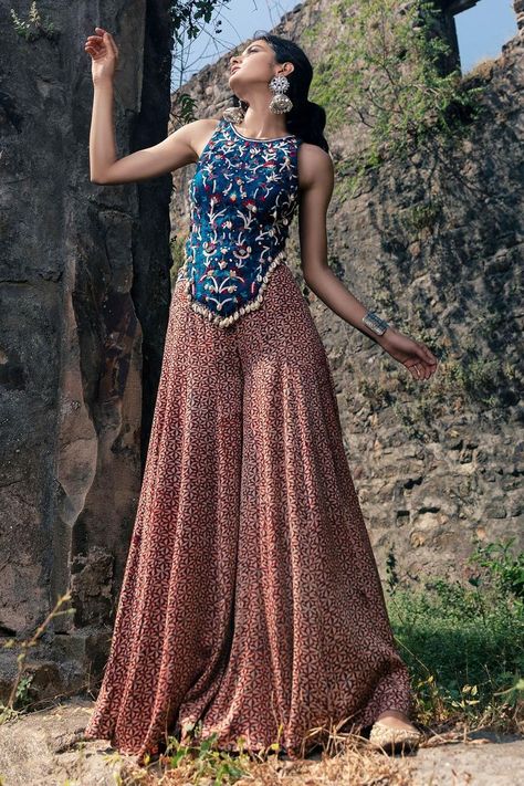 Buy #peach flared #palazzo with indigo blue & pink printed motifs by #NitaraDhanraj at #AzaFashions Shop online now at #Azafashions.com Call +91 8291990059 or email contactus@azafashions.com for enquiries. #wedding #festive #ethnic #tradional #shopping #shoponline #party #reception #bride Printed Skirt Top Indian Outfit, Palazzo And Top, Cape Skirt, Flared Palazzo, Navratri Dress, Trendy Outfits Indian, Anamika Khanna, Traditional Indian Dress, Casual Indian Fashion