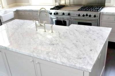 Carrara Marble Countertop: QUESTION: I'm aware that White Carrara Marble is frowned upon for use as a kitchen countertop because it etches from food acids.   If you really like the Quartize Countertops, Honed Granite Countertops, Carrara Marble Kitchen, White Granite Slabs, Marble Kitchen Counters, White Kitchen Renovation, Kitchen Design Countertops, Granite Countertops Colors, Porcelain Countertops