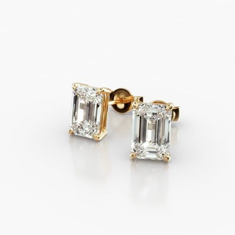 14K Yellow Gold Emerald Cut Lab-Grown Diamond Stud Earrings (1.50 CTW - F-G / VS2-SI1). This pair of classic pear shape diamond earrings feature a tapered basket, showcasing the unique characteristics and striking outline of a pear shape diamond. Splinters of light shimmer and shine with every move. Emerald Cut Diamond Earrings, Jewelry Photoshoot, Emerald Cut Diamond, Unique Characteristics, Gold Diamond Earrings, Diamond Stud Earrings, Pear Shaped Diamond, Diamond Stud, Emerald Cut Diamonds