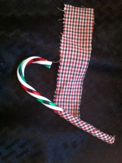 fabric covered candy canes, crafts, seasonal holiday decor, Hot glue one end then wrap the fabric around the candy cane Outdoor Christmas Decorations Lights, Candy Cane Ornaments, Homemade Fabric Softener, Primitive Country Christmas, Candy Cane Crafts, Canes Decor, Mercury Glass Christmas Ornaments, Candy Cane Ornament, Candy Cane Wreath