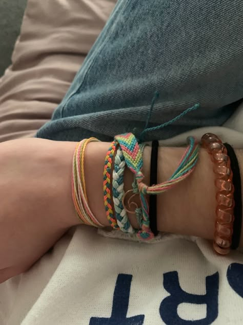 Surfer Bracelets Aesthetic, Multiple Bracelets Aesthetic, Bracelet Asethic, Cute Bracelets Aesthetic, Pura Vida Bracelet Stack, Handmade Bracelets Aesthetic, String Bracelet Aesthetic, Layered Bracelets Aesthetic, Beach Bracelets Aesthetic