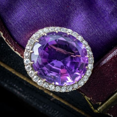 New in! A beautiful antique Victorian brooch showcasing a magnificent oval cut amethyst weighing an impressive 28 carats (approx.) It displays a deep violet hue and is complemented by a halo of twinkling old mine cut diamonds chasing around the outside, totalling approx. 2.2ct. The gallery is modelled in 15ct gold and features a secure claw setting for the amethyst, pierced sides and a pin at the back complete with a locking catch. It dates to the late 19th Century and boasts a gorgeous col... British Crown Jewels, Victorian Brooch, Edwardian Engagement Ring, Vintage Jewelry Antique, Antique Jewelry Rings, Edwardian Jewelry, Jewelry Advice, Antique Bracelets, Claw Setting