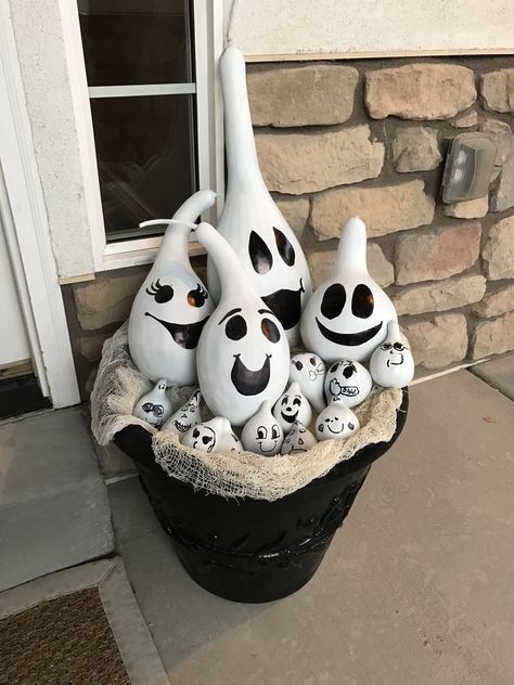 Gourd ghosts. I had a ton of extra gourds from my garden, so I spray painted them with flat white paint and the kids and I added faces with black sharpie. Ghost Gourd Painting, Diy Painting Gords, Painted Ghost Gourds, Painted Gourds Ideas Halloween, Crafts With Gourds, Fall Painted Gourds, Gourd Painting Ideas Halloween, Gourd Bowls Ideas, Halloween Painted Gourds