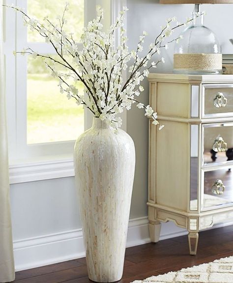 @coupleofagents || Who knew plants, fake or real, could make all the difference in a living room scene?! This extra large vase really brings the room to life! We love the beige and neutral tones too 🌿  #CoupleOfAgentsRealEstate #myphx Vase With Sticks, Vases Decor Living Room, Floor Vase Fillers, Large Vases Decor, Floor Vase Decor, Large Floor Vase, Tall Floor Vases, Big Vases, Purple Decor