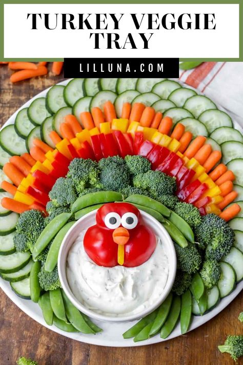 This adorable Turkey Veggie Tray is so simple, even the kids can help! It's a perfect centerpiece for your Thanksgiving spread. #turkeyveggietray #veggietray #thanksgivingappetizers #appetizer #thanksgiving Thanksgiving Vegetable Tray, Turkey Vegetable Tray, Turkey Veggie Platter, Thanksgiving Veggie Tray, Vegetable Turkey, Turkey Veggie Tray, Thanksgiving Veggies, Veggie Appetizers, Thanksgiving Vegetables