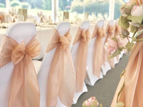 Magical Touch Venue Styling in Essex - Wedding Chair Covers | hitched.co.uk Tulle Chair Decorations, Wedding Chair Cover Ideas, Chair Bows Wedding, Pink Chair Covers, Gold Wedding Chairs, Wedding Chair Decor, Wedding Chair Cover, Wedding Columns, Wedding Chair Covers