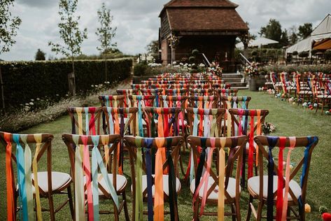 Wedding Chairs Ribbon, Ribbons Hanging From Trees Outdoor Weddings, Ribbon Ceremony Wedding, Hanging Ribbons Wedding, Wedding Chairs With Ribbon, Wedding Decor With Ribbons, Colorful Ribbon Wedding, Cheap Colorful Wedding, Rustic Rainbow Wedding