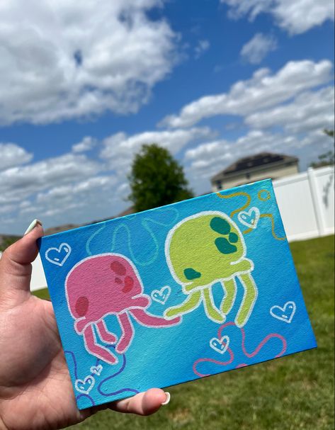 I used paint markers for the jellyfish and arylic paint for the background !:3 Spongebob Jellyfish Painting Canvas, Sponge Bob Jelly Fish Painting, Cute Drawings And Paintings, Painting Ideas On Canvas Paint Markers, Cute Fun Painting Ideas, Spongebob Posca Art, Drawings With Paint Markers, Things To Paint For Friends, Paint Marker Canvas Ideas