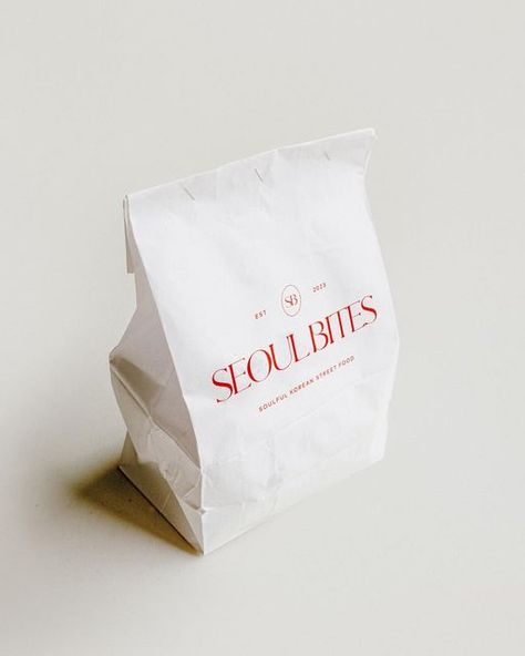 Image of red Seoul Bites logo on a paper takeaway packaging bag. Korean Restaurant Branding, Korean Food Branding, Bites Packaging, Korean Packaging Design, Korean Branding, Korean Packaging, Korean Pastry, Korean Logo, Pickled Cucumber