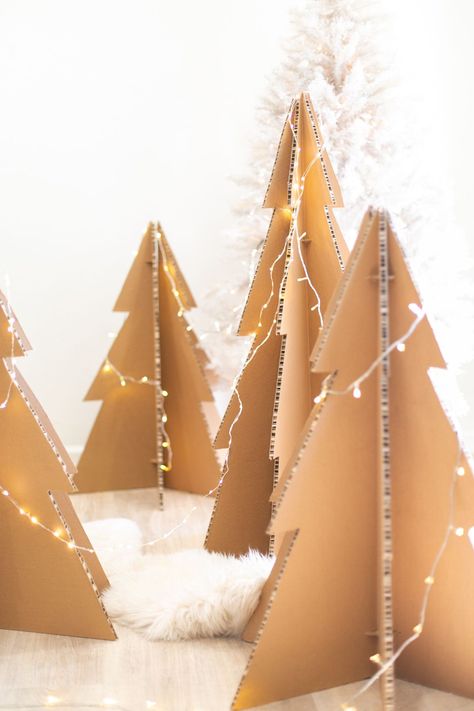 These life-sized cardboard Christmas trees make a major statement but are so easy to create! They're easy to store flat and will last again and again. Perfect winter holiday decor idea for indoor or outdoor. Click for the full tutorial! Cardboard Tree, Cardboard Christmas Tree, Cardboard Christmas, Christmas Tree Lots, Alternative Christmas, Alternative Christmas Tree, Black Christmas Trees, Crafts With Pictures, Craft Projects For Kids