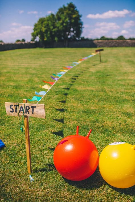 Large bouncy hoppers and other wedding games at outdoor wedding ceremony Giant Garden Games, Outdoor Wedding Games, Fun Wedding Games, Garden Wedding Games, Festival Style Wedding, Space Hopper, Wedding Game, Pink Wedding Theme, Garden Games