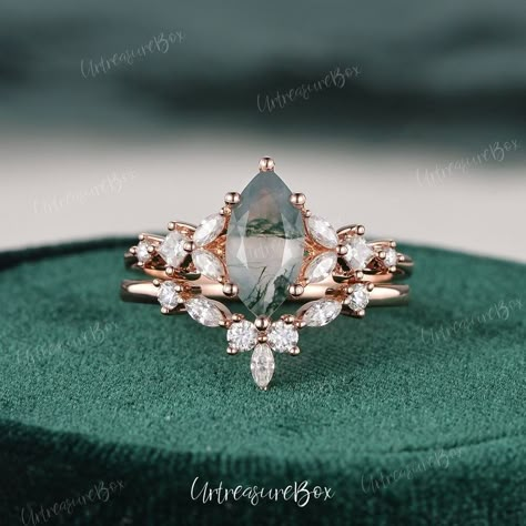 Vintage Green Moss Agate Engagement Ring Sets Marquise Cut Rose Gold Bridal Sets Crystal Ring Princess Cut Moissnaite Ring Women Wedding Set * Order Service: Engraving/Rush Order/ Shipping Upgrade/ Size Upgrade/ 18K or Platinum upgrade https://www.etsy.com/listing/889751602/ Jewelry Details:  * Center Stone: Green Moss Agate, Marquise cut  * Measures: 6x12mm  * Accents Stones: Colorless Moissanite or Natural Diamonds  * about 0.5carats * Natural Diamond: * Color & Clarity: H, SI * Metal Type:  S Vintage Moss Agate Engagement Ring, Vintage Moss Agate Wedding Ring, Green Moss Agate Engagement Ring, Moss Agate Engagement Ring Gold, Miss Agate Engagement Ring Gold, Princess Moss Agate Engagement Ring, Miss Agate Engagement Ring Set, Green Stone Engagement Ring, Gold Bridal Sets