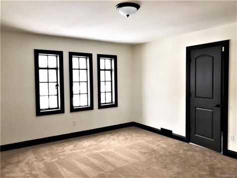 Charcoal Baseboards, Black Trimming Interior, Black Baseboards And Doors, Dark Colored Baseboards And Trim, Dark Painted Baseboards And Trim, Dark Painted Doors And Trim, Black Stained Trim Interior, Matte Black Baseboards, Dark Door Interior