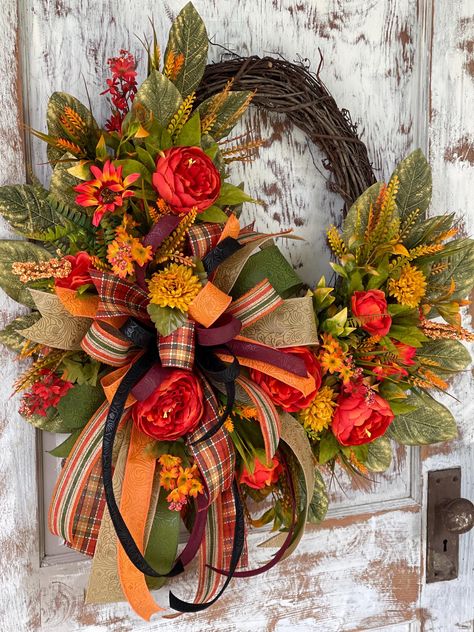 Fall Peonies with Wild Flower Wreath with Bow. A Variety of Greenery accents the floral. With a Large Fall Bow that accents the Fall Colors. Large Size. Fits standard size door or Larger doors. Approx 26" wide and 30" in length. Measurements may vary slightly( 1-2") depending on where you measure. Each One is hand made by me.  Depth is 5-6". This wreath actually is designed to match the hanging baskets I have in my shop. Large Fall Wreaths, Thanksgiving Wreaths For Front Door, Fall Peonies, Boho Fall Wreath, Modern Fall Wreath, Pink Wreaths, Fall Floral Wreath, Wreath With Bow, Decorative Wreaths