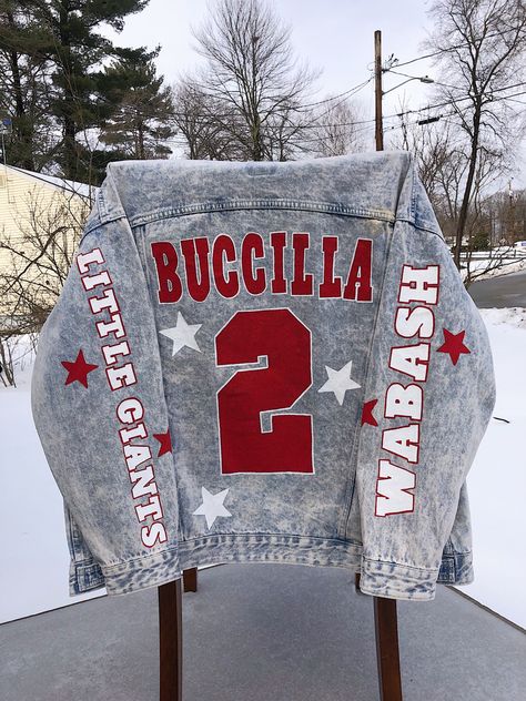 Football Blue Jean Jacket, Boyfriend Football Jean Jacket, Painted Football Jeans, Cricut Jacket Ideas, Painted College Jean Jacket, Football Mom Jean Jacket, Football Jean Jacket Diy, Jean Jacket Painted Football, Cheer Coach Jean Jacket