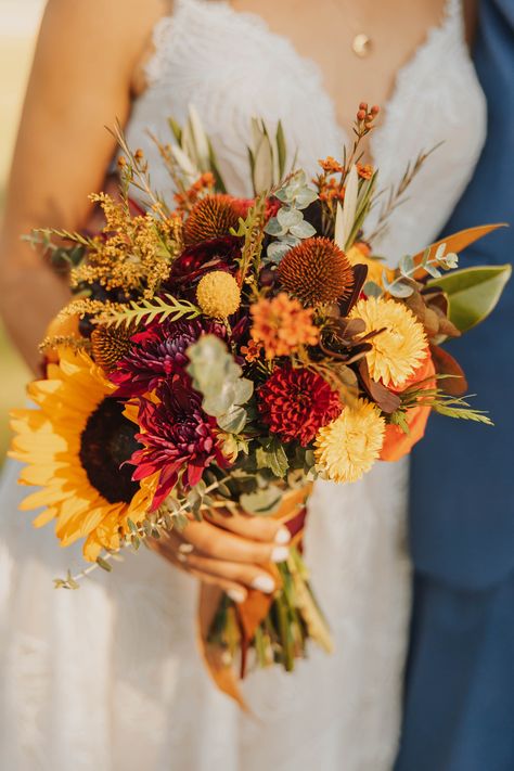 Autumn wedding at a Rustic Montana venue during golden hour! Fall Bouquet Wedding Sunflowers, Terracotta Wildflower Bouquet, Autumn Bridal Flowers, Fall Bouquet Sunflower, Fall Wedding Flowers Sunflowers, Whimsical Fall Bouquet, Fall Wedding Ideas October Centerpieces, Simple Sunflower Wedding Bouquet, Fall Sunflower Wedding Bouquet